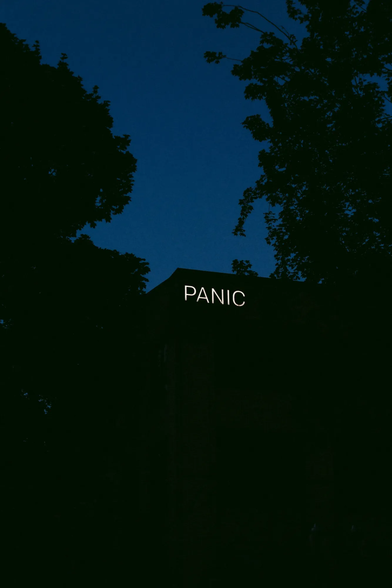 A glowing PANIC sign at night, the feeling of a full disk